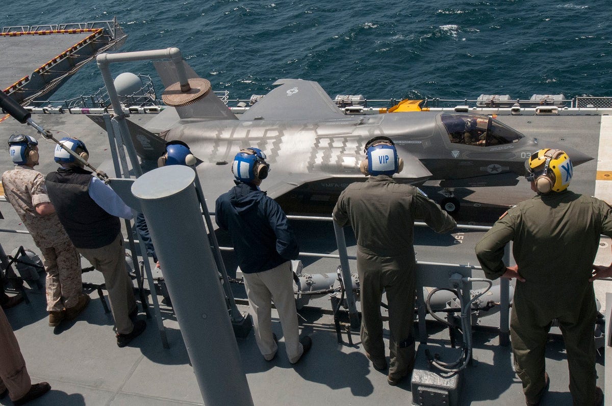 150520-N-BQ308-203 ATLANTIC OCEAN (May 20, 2015) The amphibious assault ship USS Wasp’s (LHD 1) executive officer Capt. Andrew Smith watches over a group of distinguished visitors as they view F-35B flight operations. Distinguished visitors visited Wasp as she conducts the F-35B first phase operational testing to include flight deck operations, maintenance operations and logistical supply chain operations at sea. (U.S. Navy photo by Chief Mass Communication Specialist William Tonacchio/Released)