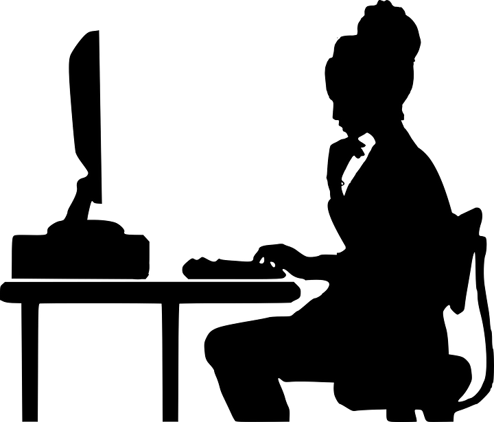 silhouette of a Woman at a keyboard writing a blog post