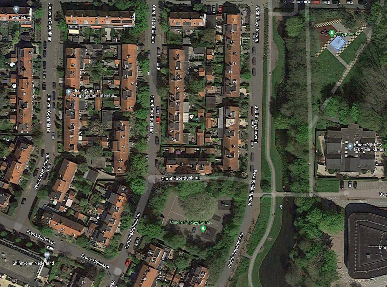 While dense, Dutch neighborhoods still have plenty of green public spaces. Notice two playgrounds and green canal area.