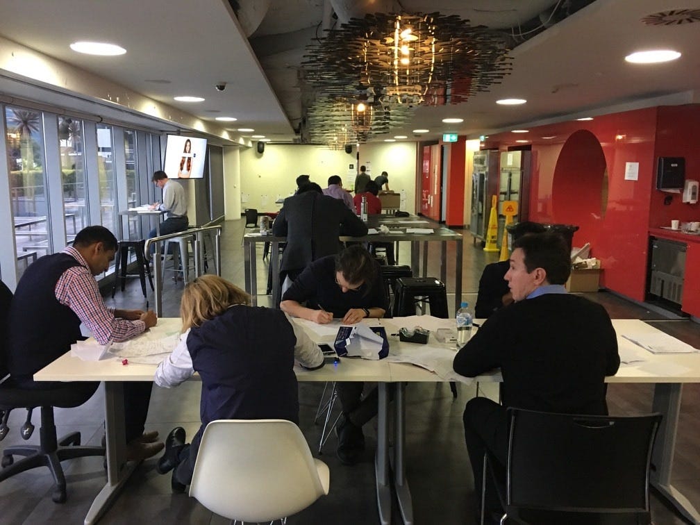 Everyone sketching away during Crazy Eights â a rapid sketching exercise designed to get the juices flowing