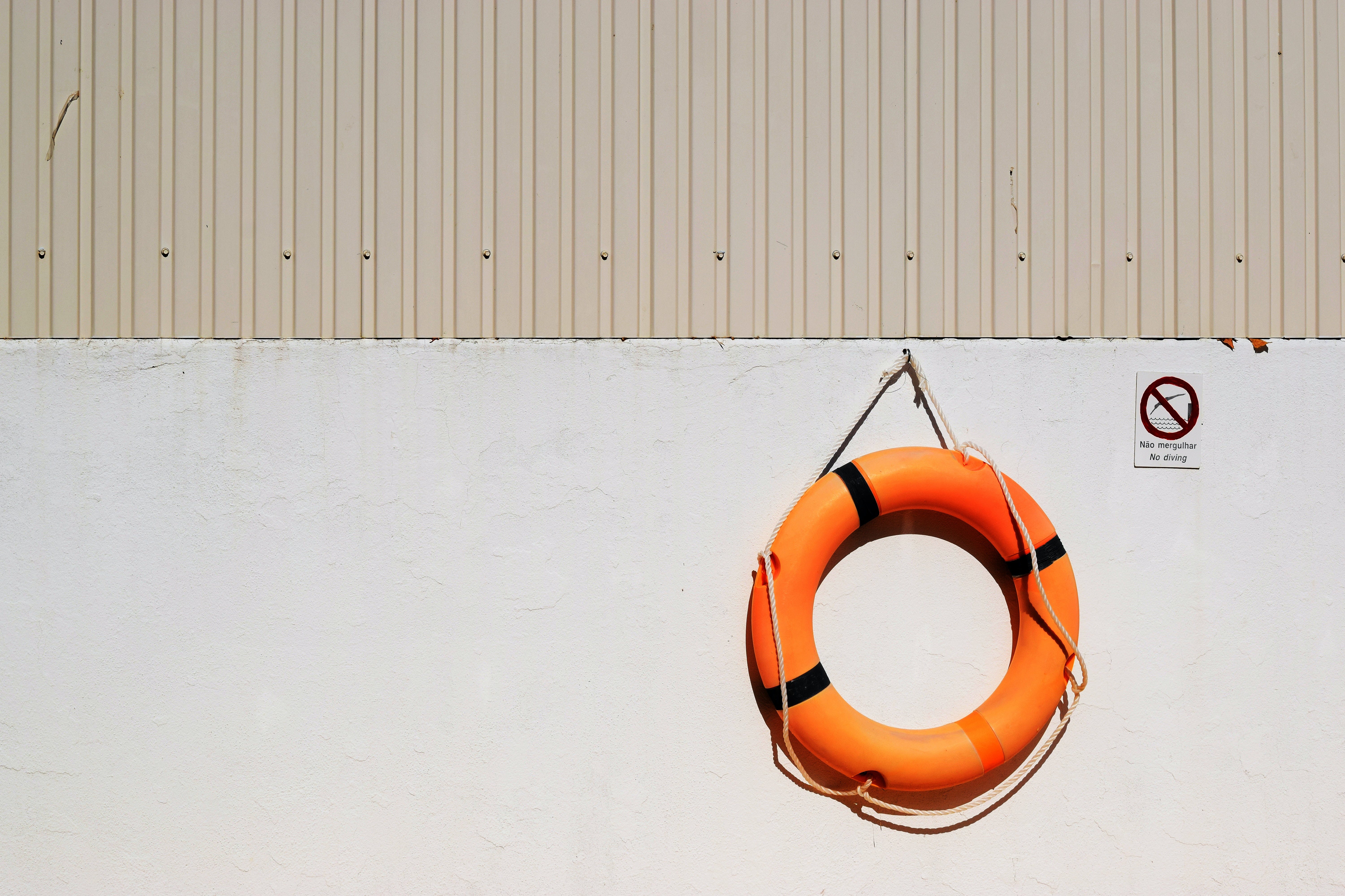 A lifebuoy hanging on a wall.