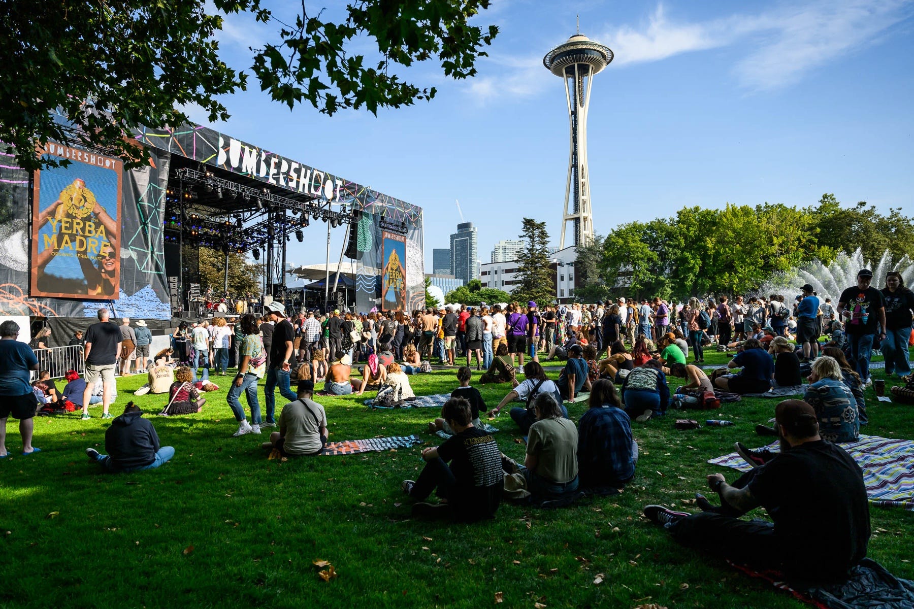 Crowds enjoying Bumbershoot at Seattle Center during Labor Day weekend with the Space Needle in the background