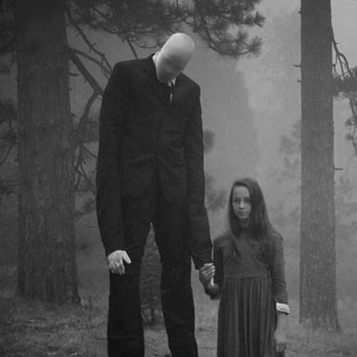 Slender Man holding hands with a young girl in the forest