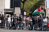 Protests in and around Columbia University in support of Palestine and against Israeli occupation. A side gate by the bookstore where the crowd is — inside and out.