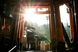 An epic Japanese sunrise viewed from a traditional wooden structure