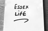 Black and white photo of a Post-It with ‘Essex Life’ written in black marker