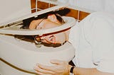 Photo of man throwing up in toilet.