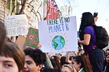 Climate Protest with a sign saying “There is no Planet B”