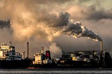 photo of smoke going into the air from a ship