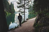 Hiker taking in lakeside view