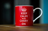 A mug bearing the phrase “Keep Calm and Carry On”