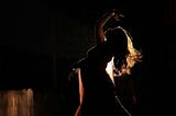 Dancer in profile on stage