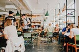 People dining and working in a restaurant.