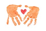 hand print in organge color. two hands with a heart shape in the middle