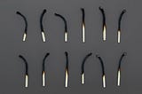 burned matches lined up