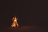 A big fire appearing like a woman, at night.