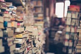 Stack and stack of books, slighty out of focus