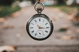 Stopwatch with a road in the background.