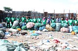 A handful of the fantastic waste collectors from our clean-up in Arusha with the waste collected during the clean-up.