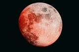 A moon tinged with red