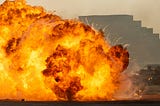 Massive fire explosion close up in military combat and war. Vehicle explosion from a tank in a city in the Middle East. Military Concept. Strength, power, explosion.