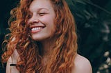 Woman with red hair smiling