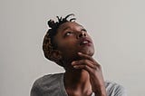 Photo of woman looking up, deep in thought