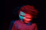 This is a slow-exposure photo of a man in a delusional state of shaking his head. It’s meant to represent the ambivalent experience of taking drugs. The narrator in this poem seeks to stop it.