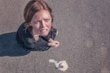 Sad woman and a dropped ice cream cone
