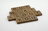image with wood background saying “But What About You”