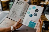 An open text book showing a diagram of a business process.
