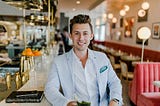 Man sitting at bar service of an old-time cafe.