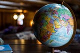 A globe on a table in a library