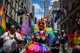 A bunch of people dressed in rainbow outfits