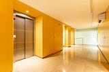 Elevators and a gleaming corridor