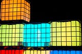 glowing colored cubes stacked on top of each other