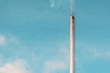 The flag of Argentina against a light blue sky