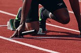runner waiting for start of relay race