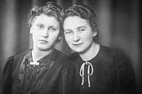 Black and white photo of two young women, friends, smiling