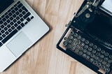 A Macbook beside a Typewriter to compare old & new techniques