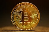 A bitcoin is standing alone