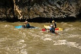 Kayaking in a lake — people rafting and kayaking