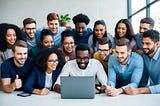 A group of diverse people eagerly gather around a digital device, eagerly awaiting the announcement of an airdrop price