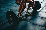 An image of a man doing deadlifts.