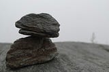 A stone balancing on another stone.