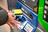 Person using an ATM machine