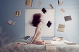 Girl with books around her