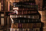 Stack of old, leather-bound books.