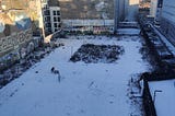 The view from my balcony on the morning of 21st January 2022, after a night of heavy snowfall in Berlin. The basketball court and the road leading up to the river Spree covered in snow.