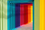 A beautiful rainbow lit hallway leading into a place of light